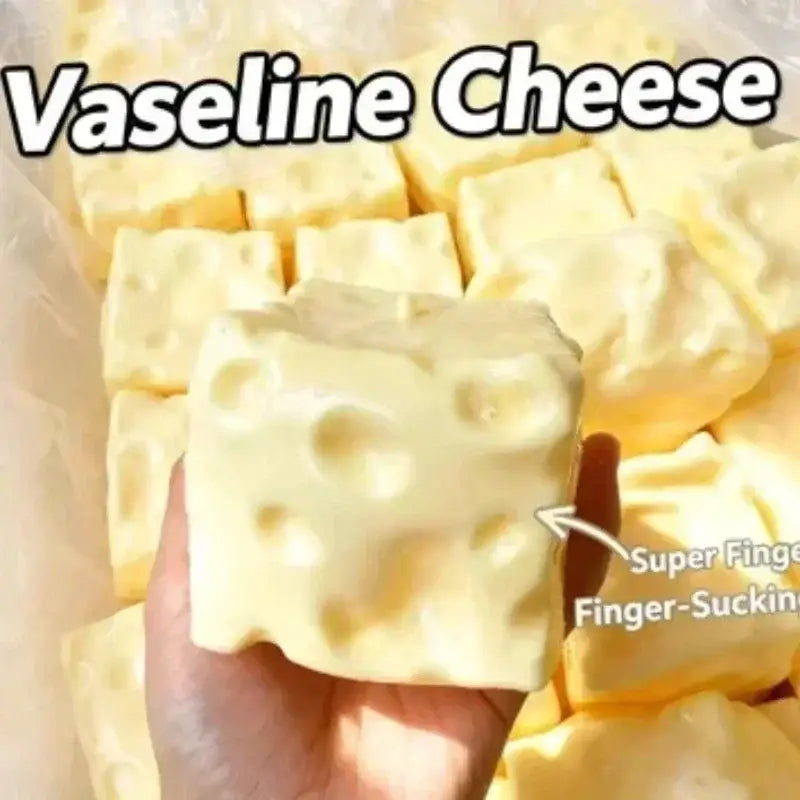 Jouet à mâcher et à malaxer en forme de fromage, conçu pour soulager le stress, texture souple et molle, fabriqué à partir d’un fromage en vaseline de cube jaune pâle, avec des orifices caractéristiques, pour apaiser le stress lié au jouet.