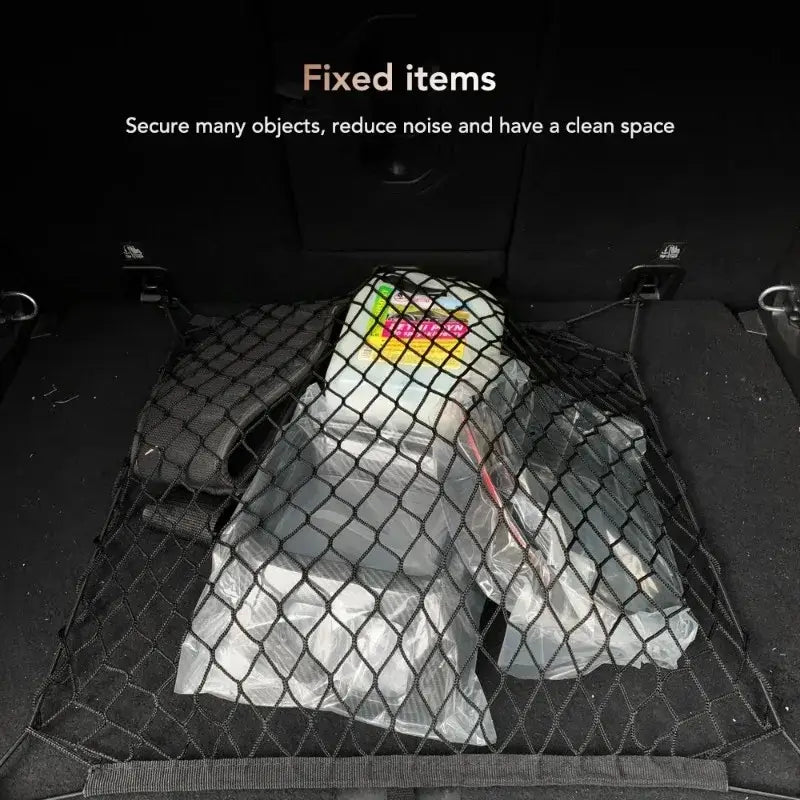 Black nylon mesh cargo net for car trunks designed to secure items and keep the storage space tidy