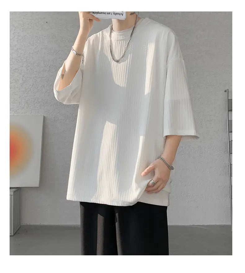 men striped oversized summer t-shirt in white ribbed cotton with three-quarter sleeves shown from the front.