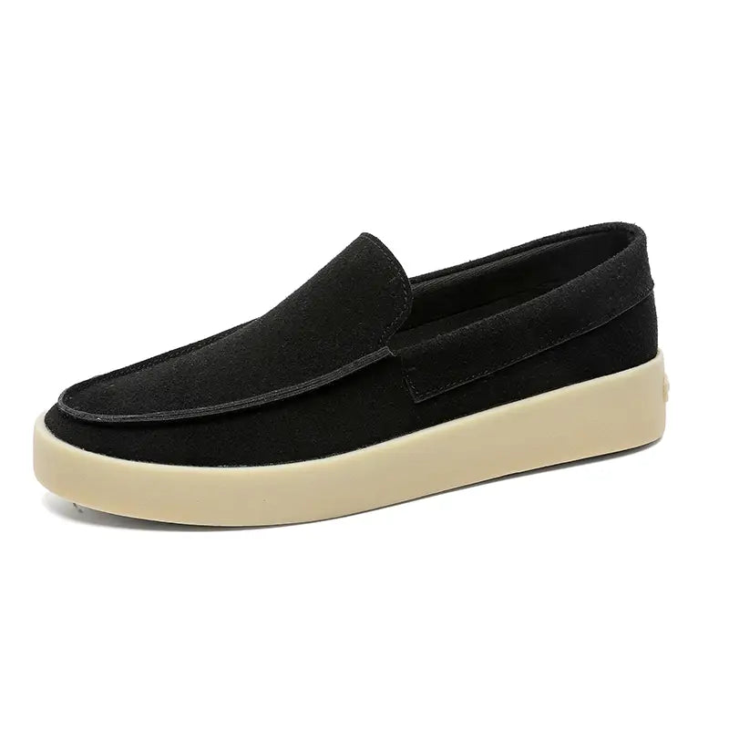 Black suede men’s casual loafers with cream-colored rubber slip-on soles designed for walking.