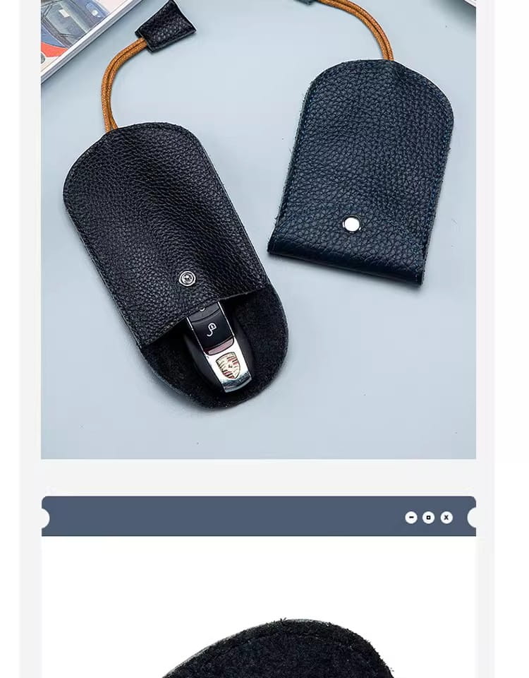 Schwarzes, strukturiertes Leder-Schlüsseletui mit Taschenhalterfunktion, mit beigem Kordelzug und silberfarbenem Metallverschluss für eine sichere Schlüsselspeicherung.