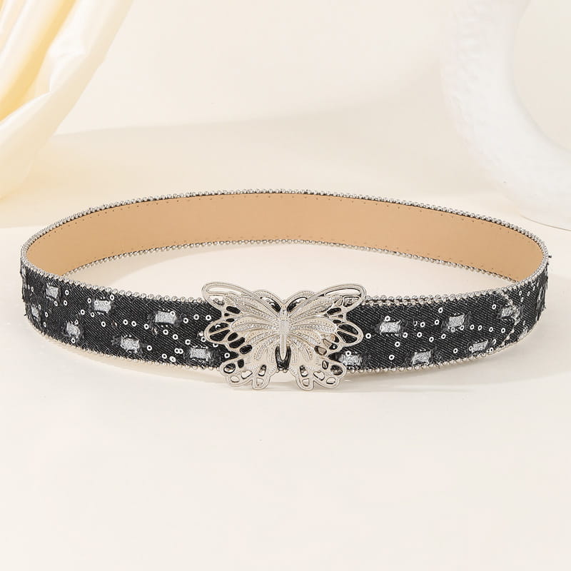Ceinture en cuir papillon y2k à sequins noirs avec boucle papillon argentée, présentée en angle de face