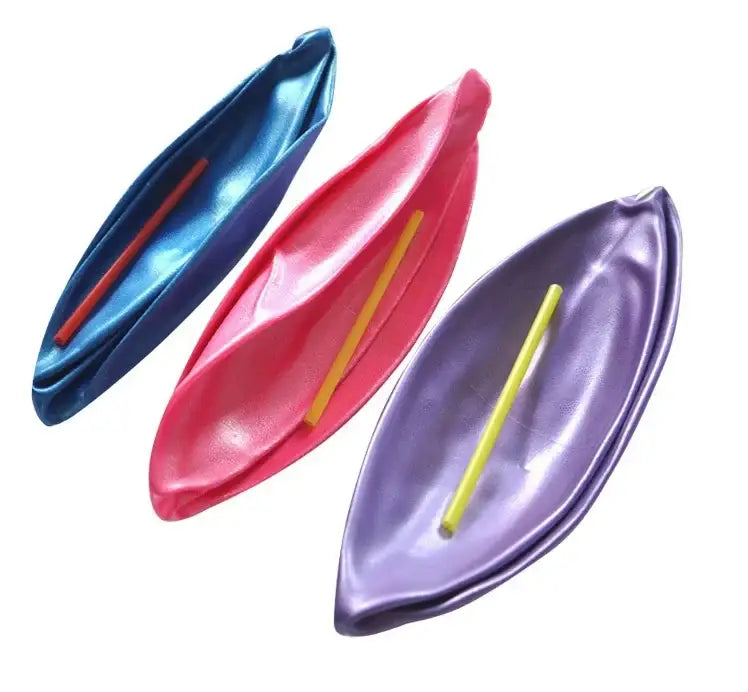 three glossy leaf-shaped balloons in blue pink and purple each with a colored stick illustrating anti-burst performance and air leakage resistance for balance training yoga ball use