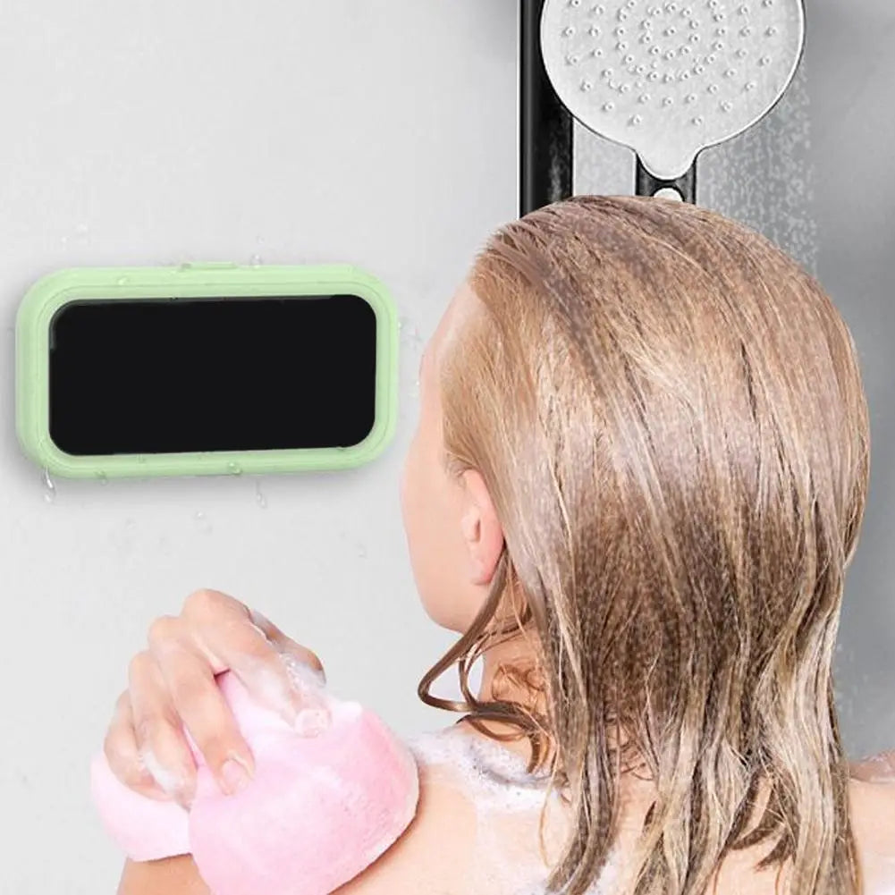 Light green rectangular waterproof case with black screen surface mounted on bathroom wall shown as a 360 degree rotating shower phone holder.