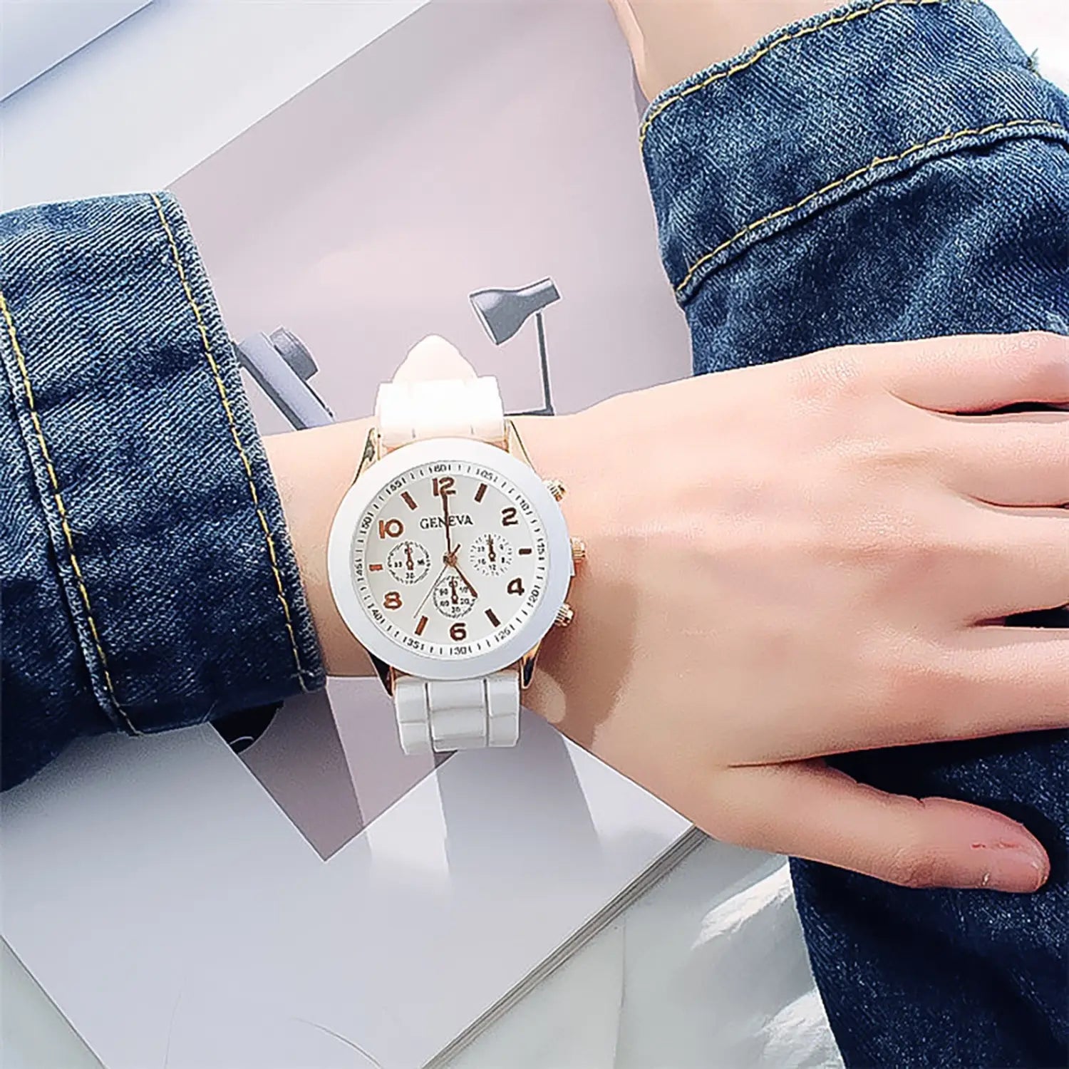 White ceramic women silicone quartz watch with gold-tone accents and a minimalist dial featuring the geneva brand name designed for fashion chronograph use.