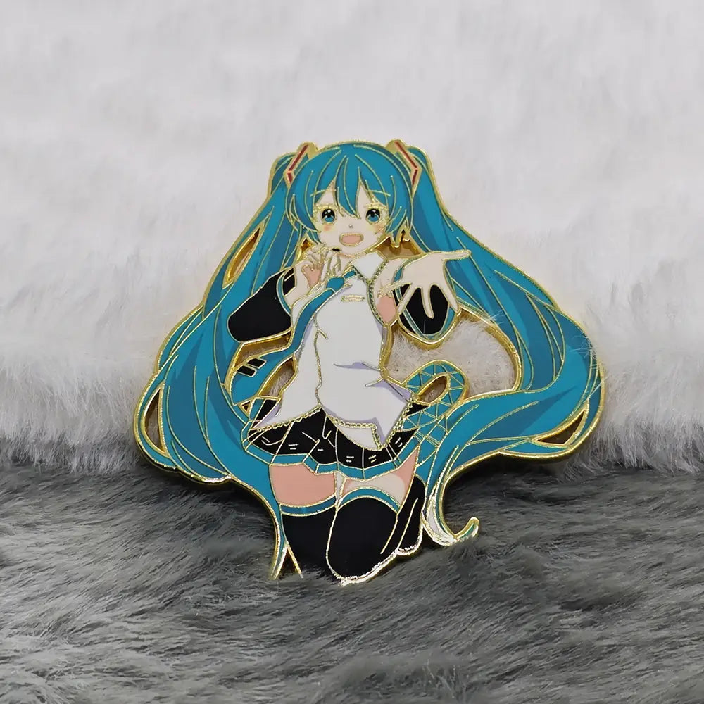 A vibrant blue-haired hatsune miku anime enamel pin metal badge with gold-trimmed details and a white outfit featuring black accents on the skirt and stockings.