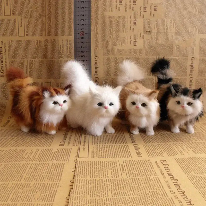 Four plush soft simulation cat plush toys with fluffy fur in white orange and black-and-white colors suitable for decoration or play.
