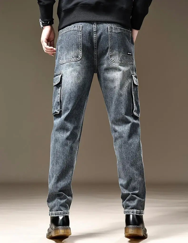 Baggy dark wash denim cargo pants with reinforced stitching and multiple pockets in dark-wash denim material.