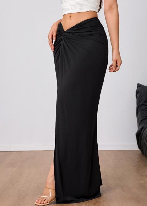 Black high waisted slit maxi skirt made of flowing fabric with a front twist detail and elegant design.