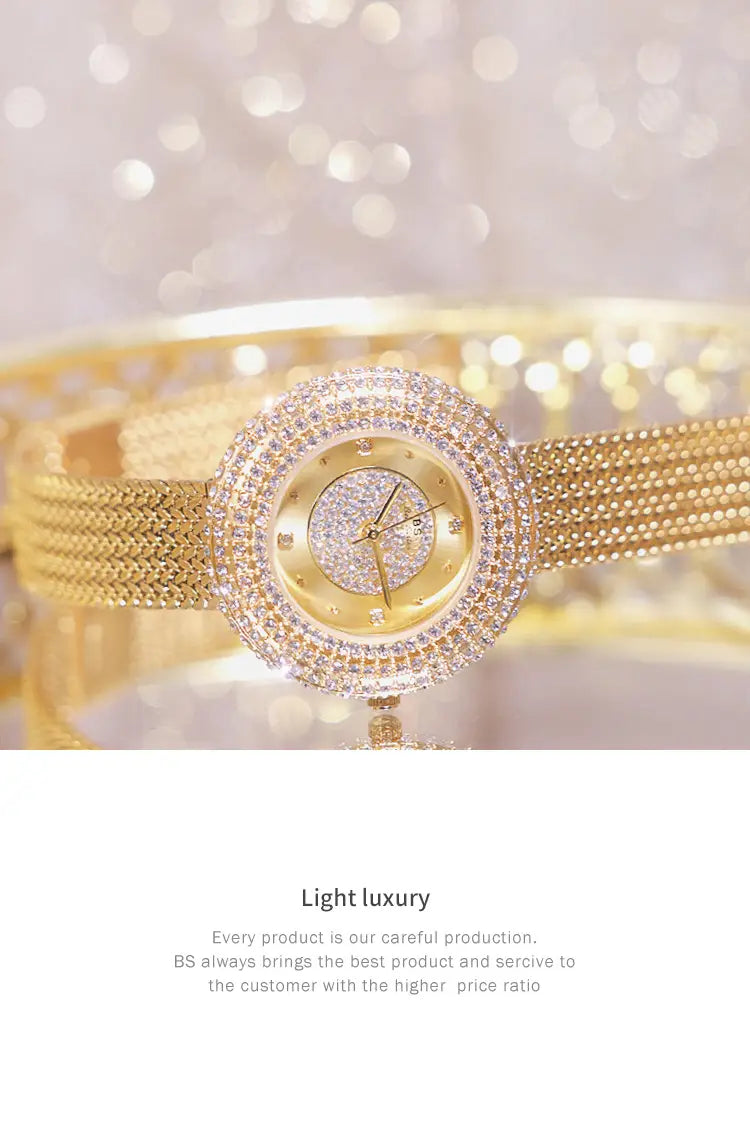 Gold diamond mesh women watch luxury waterproof with a gold-toned round face encrusted in sparkling crystals and a mesh band.