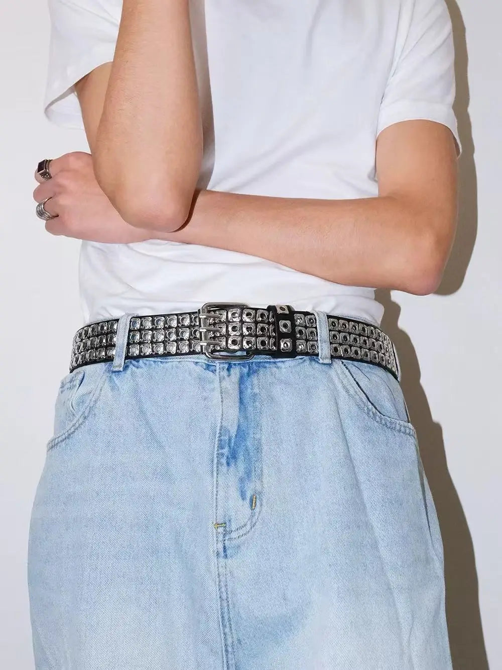 Studded leather punk belt in black with silver square studs and a matching metal buckle.