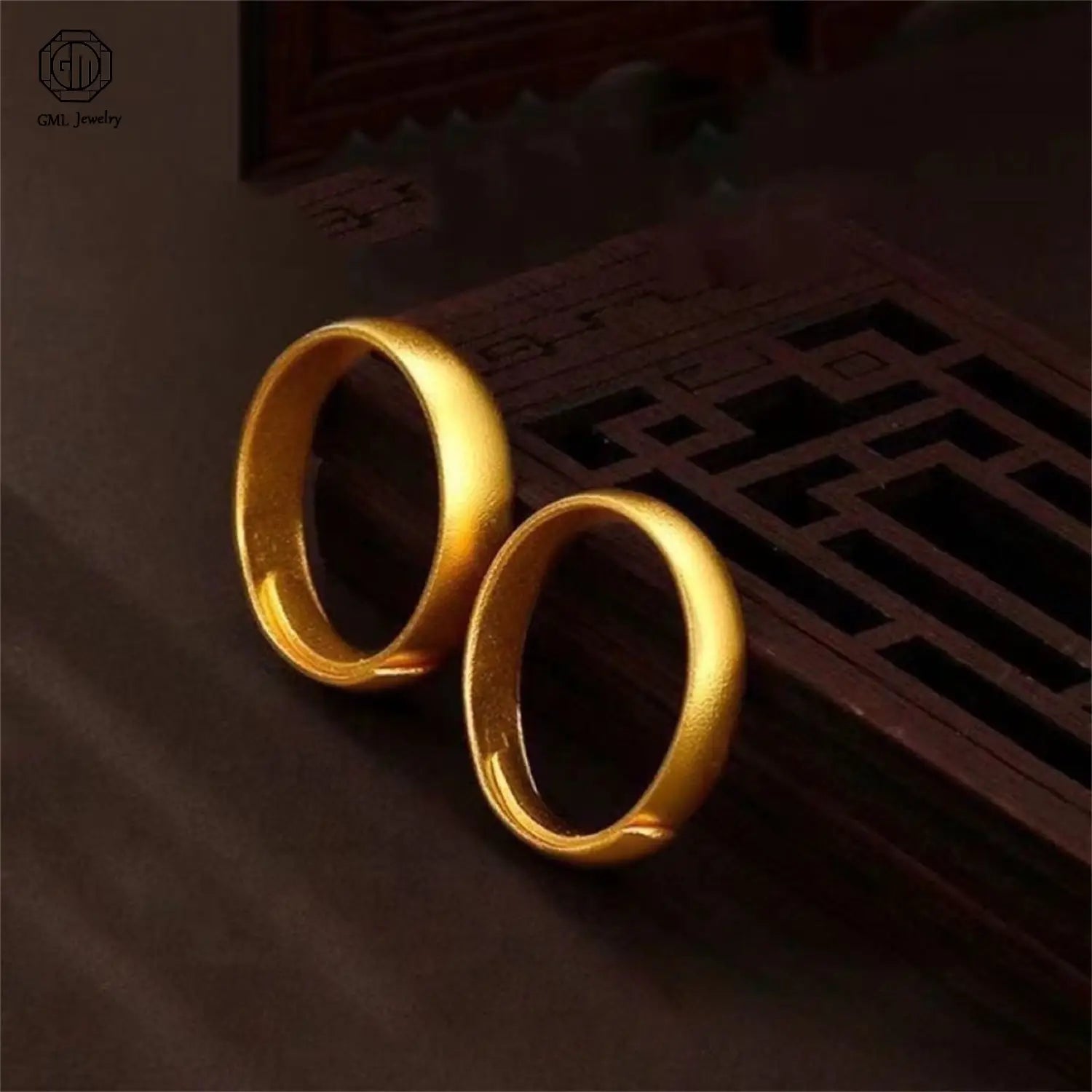 Two polished fade resistant sand gold adjustable rings with a smooth slightly rounded surface in a matte wide band design for unisex use.