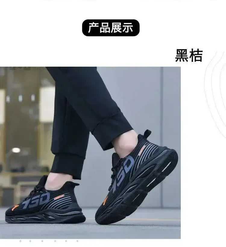 Chaussures de sport décontractées à enfiler pour hommes, respirantes pour la course, en noir, avec marquage 750 audacieux en gris foncé et touches orange, présentant une tige en mesh texturée et une semelle en caoutchouc superposée.