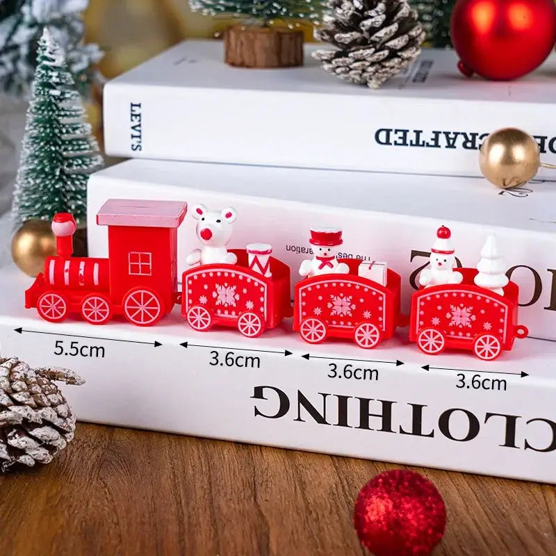 Décoration de table de fêtes de Noël en bois en forme de train, en bois rouge et plastique, comportant des figurines de bonhomme de neige et d’ours sur chaque wagon.