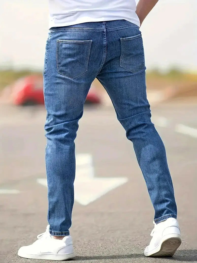 men distressed skinny jeans vintage slim fit blue denim pants shown from the back with classic slim fit and distressed details