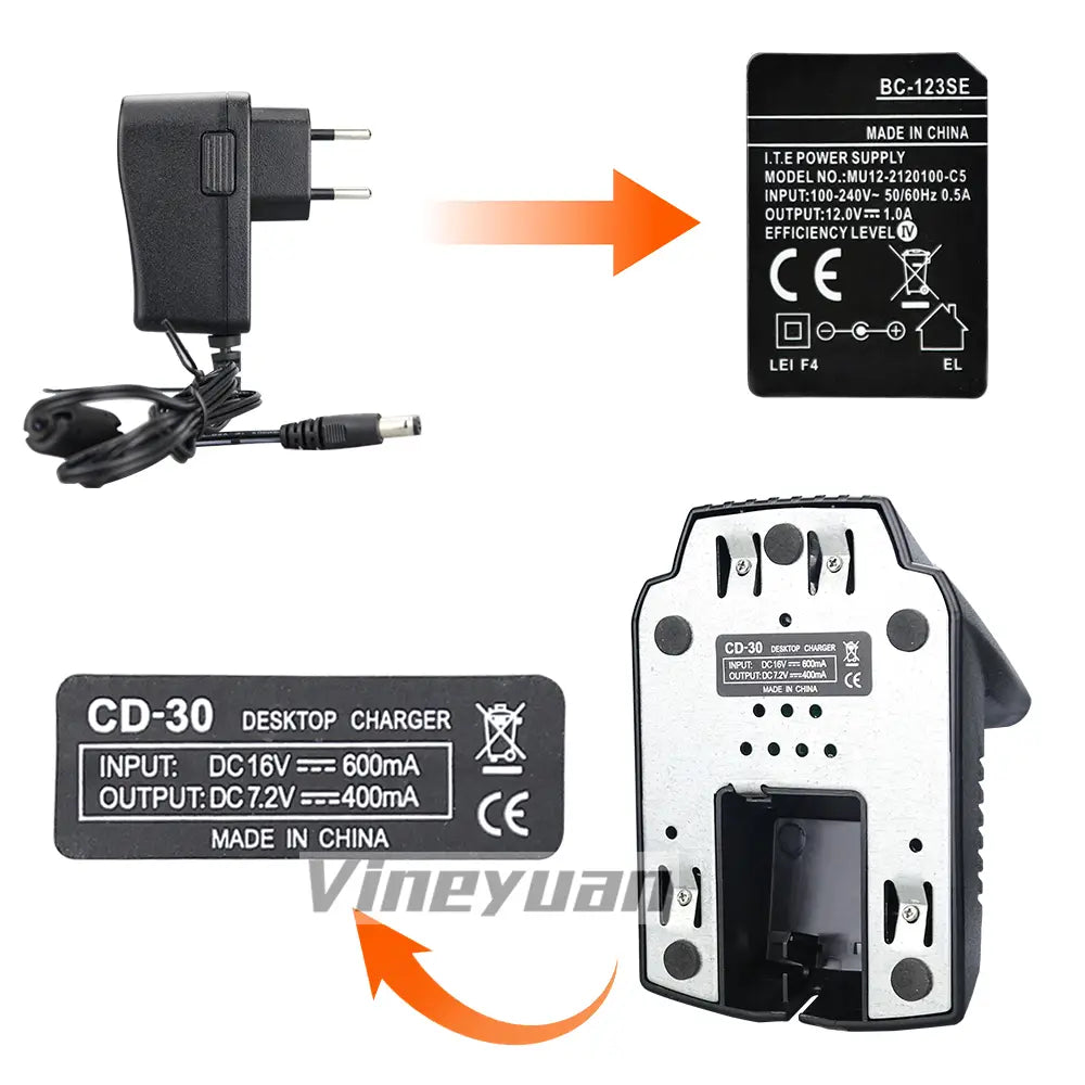 Black plastic battery charger for Yaesu Vertex Standard radio with coiled power cord, two-prong plug, and cd-30 label on the front panel.