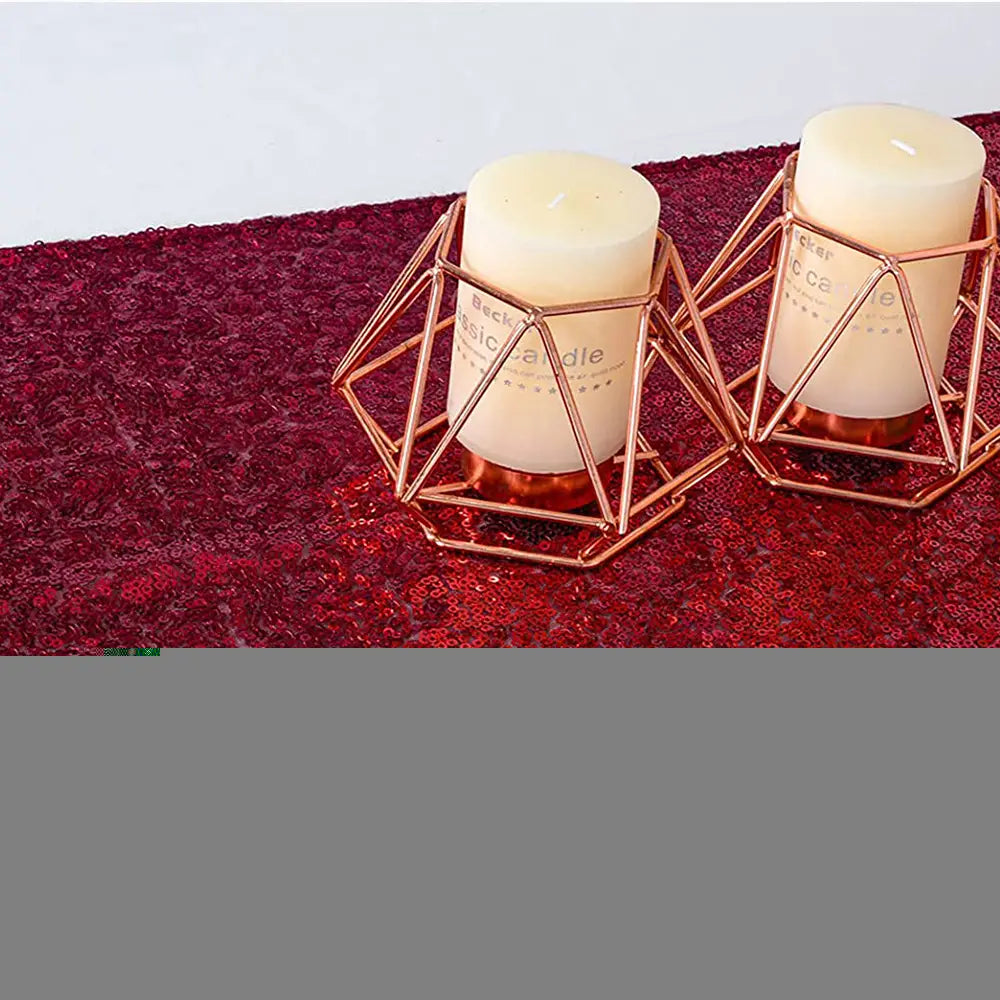 rose gold geometric candle holders cradling off-white pillar candles complementing a sequin table runner 12x72 inch party decor.