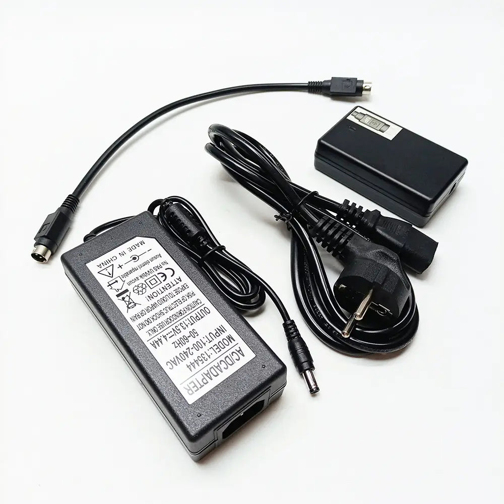 black plastic fiber fusion splicer charger with coiled cables and european-style power plug designed for mainland china use