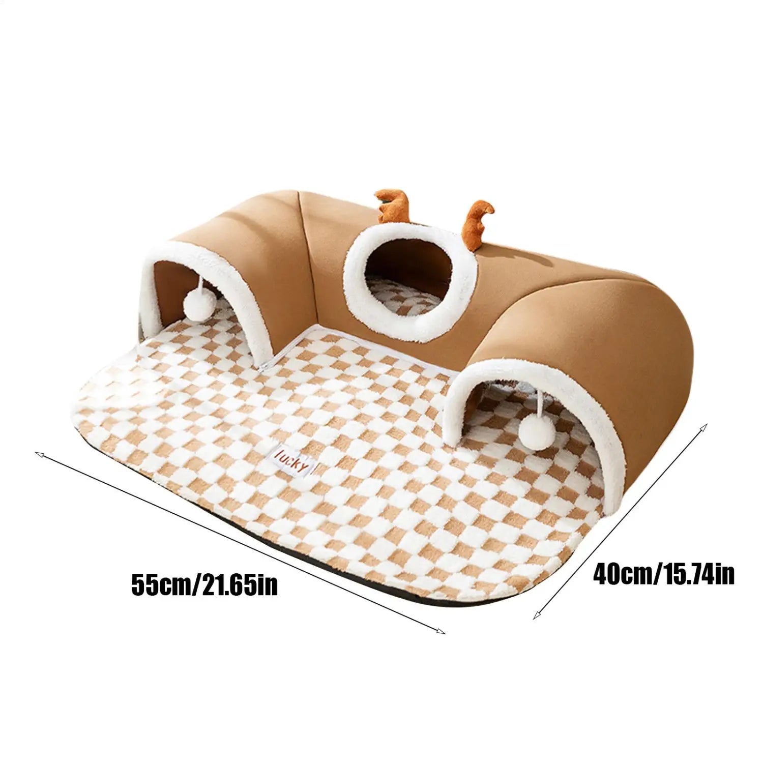 brown plush cat tunnel bed with white fur trim, checkered patterned floor, and small orange antler decorations designed as a cozy corner hideaway