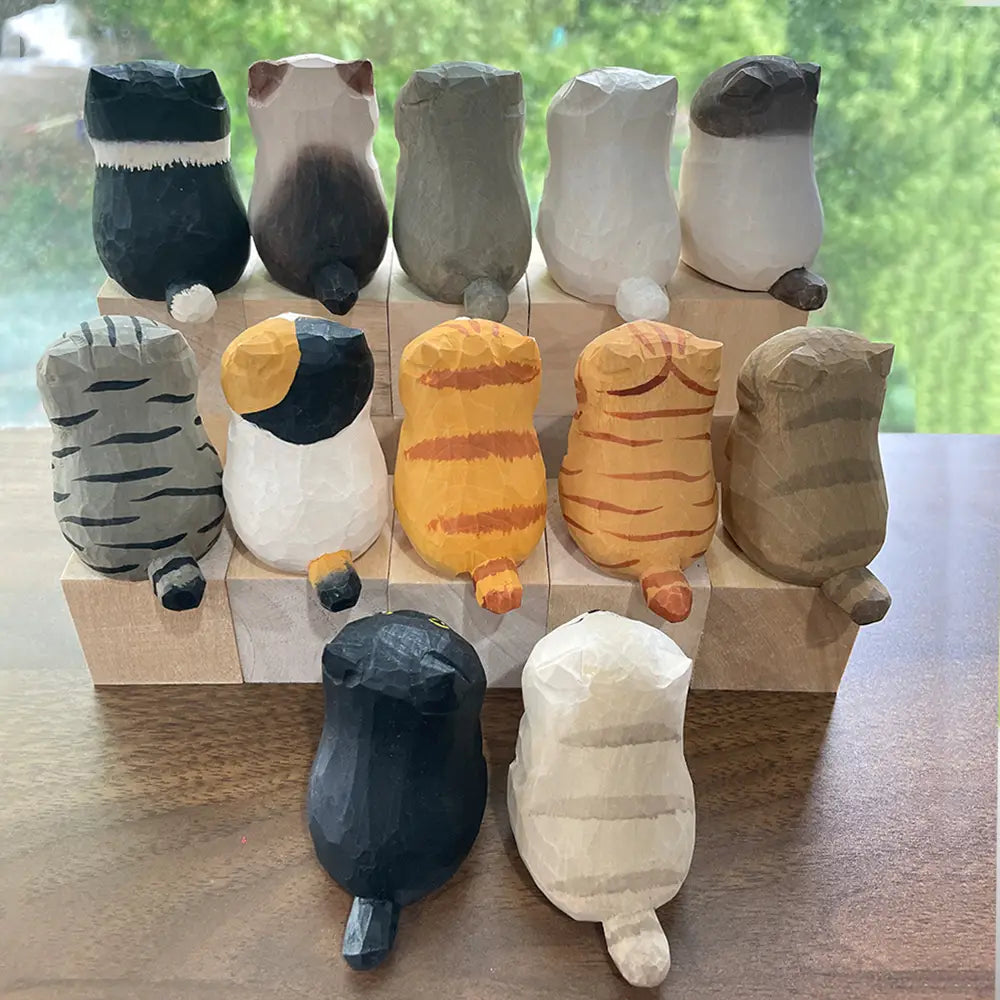 a collection of factory direct actual product handcrafted wooden cat figurine desk decor in various colors and patterns including solid black white with gray stripes orange tabby and calico