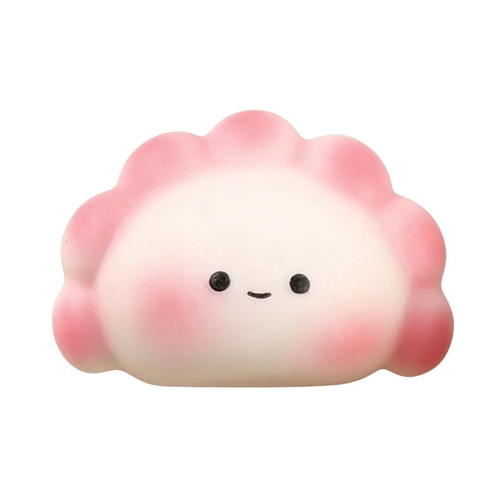 Juguete exprimible para aliviar el estrés con forma de dimsum degradada en rosa y blanco, con ojos de puntos negros y una sonrisa sencilla, para juguetear y aliviar el estrés.