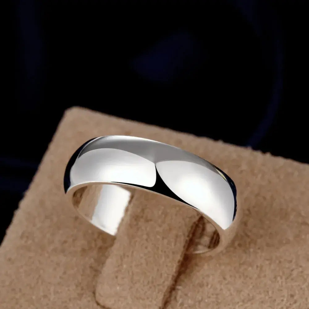A high quality sterling silver ring with a sleek polished band and smooth slightly curved design from the minimalist starburst collection available in sizes 5 to 11.
