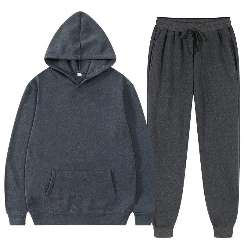 Ensemble décontracté de survêtement en molleton chiné gris foncé pour homme, comprenant un sweat à capuche décontracté et des joggers assortis, fabriqués dans un matériau doux en molleton.