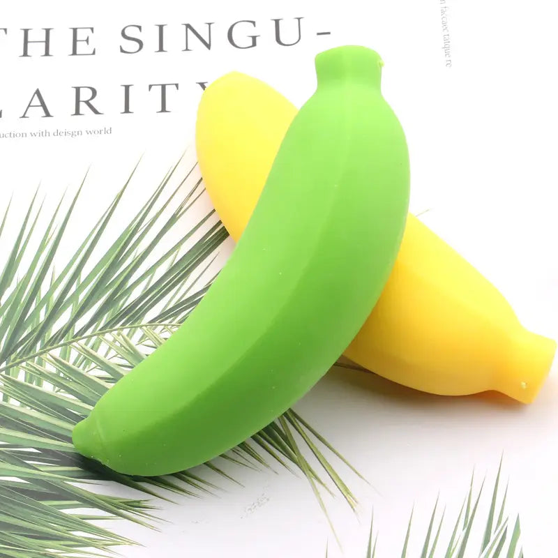 green and yellow silicone banana toys slow rising stress relief toy shown from the front angle