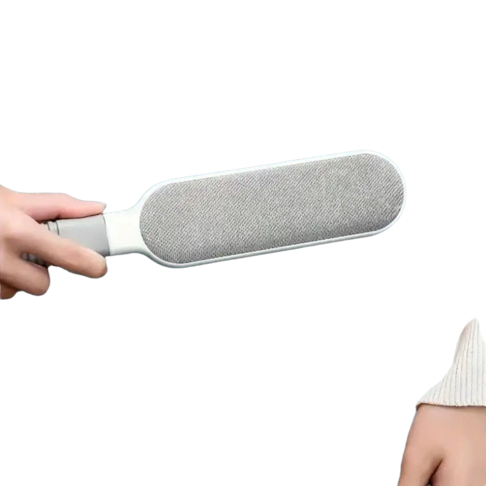 Gray and white fabric-covered double-sided pet hair remover with textured surface for manual hair ball removal
