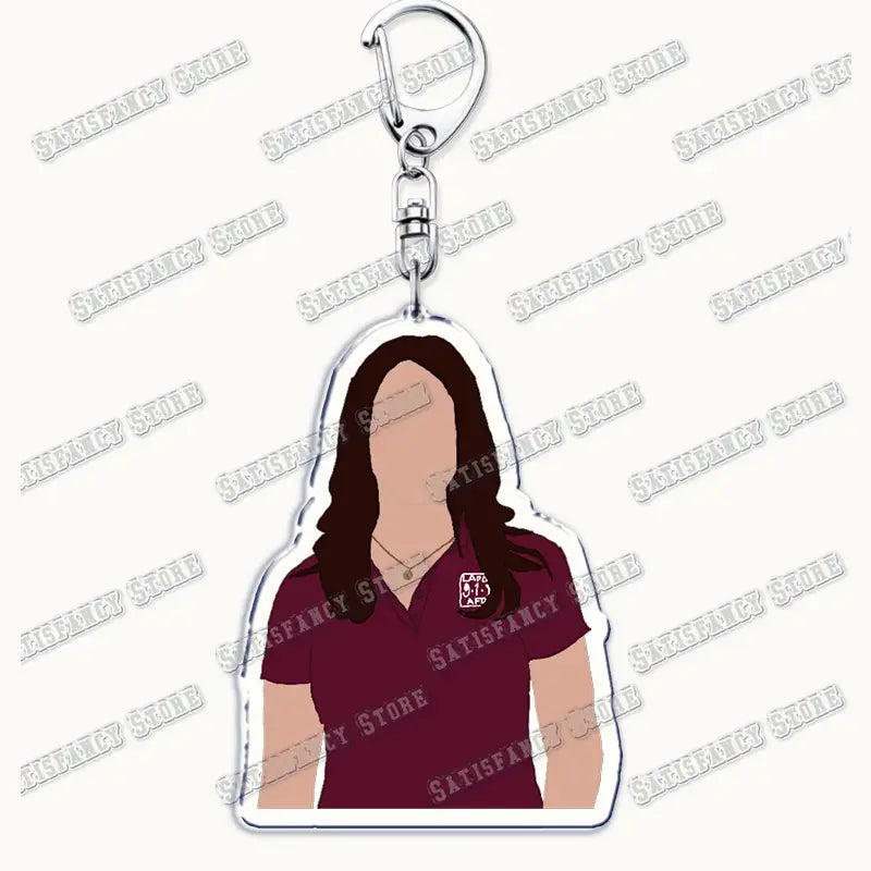 Maroon polo shirt character acrylic keychain with silver metal clasp and chain from 9-1-1 TV show firefighter gift collection.