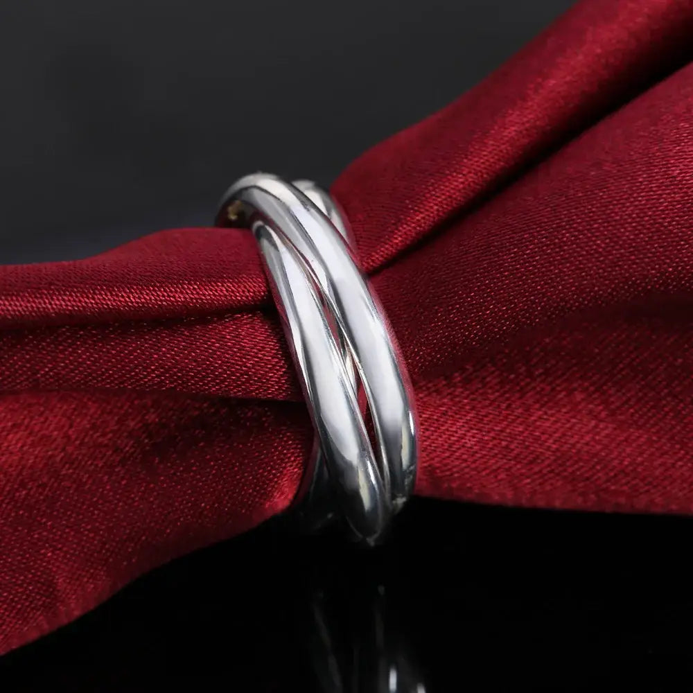 a sleek sterling silver ring for women featuring a simple three circles design with a polished metallic finish