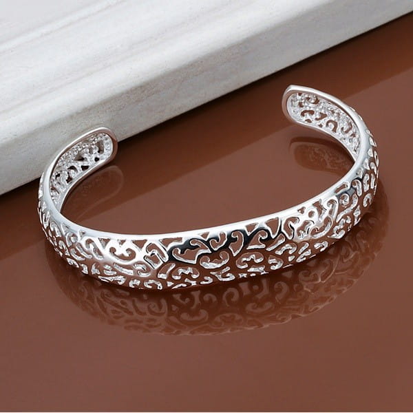 Sterling silver filigree cuff bracelet in silver featuring an intricate open cuff design.