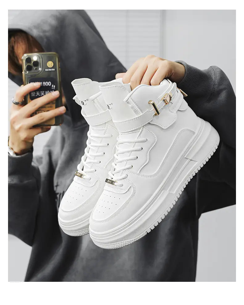 Men white high top sneakers featuring gold tone buckles and laces with a chunky sole design.