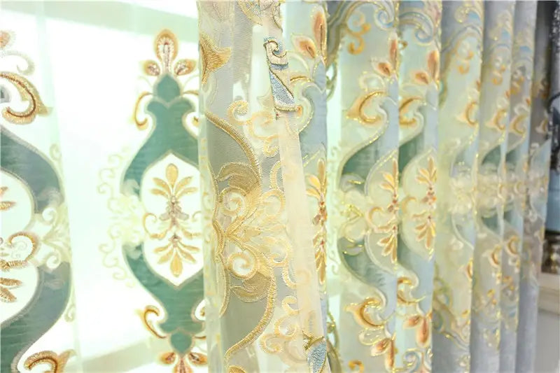 Elegant sheer embroidered living room curtains featuring intricate gold and teal floral patterns on delicate semi-transparent fabric designed for French windows.