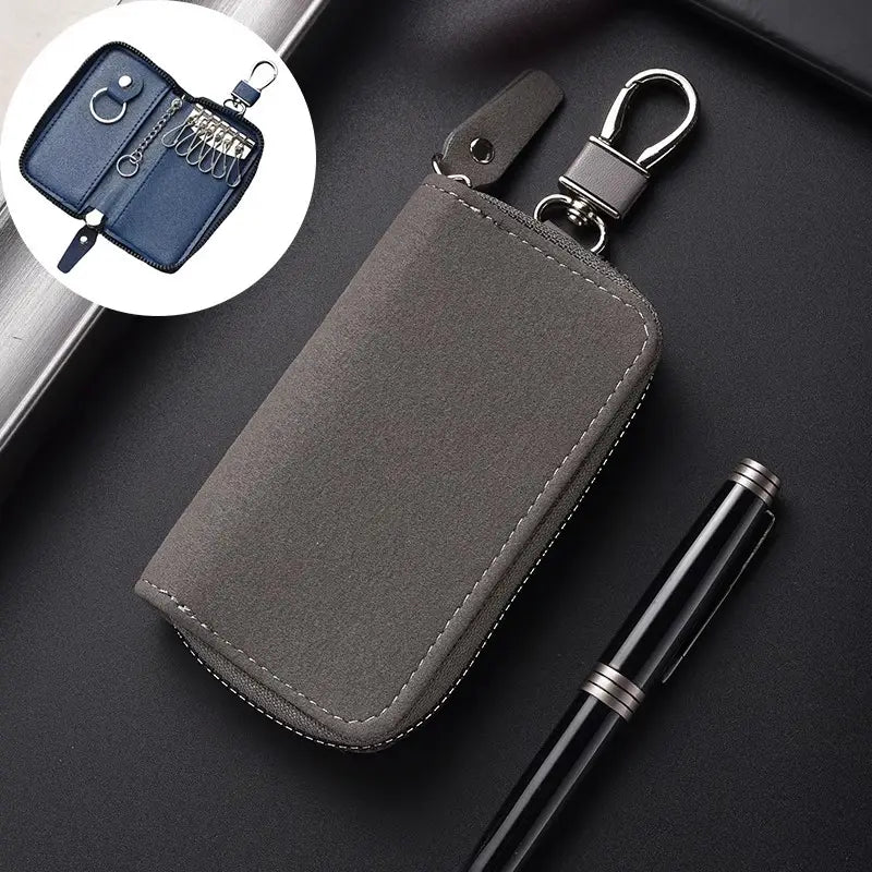 Gray suede leather key holder organizer pouch with silver zipper and metal carabiner clip.