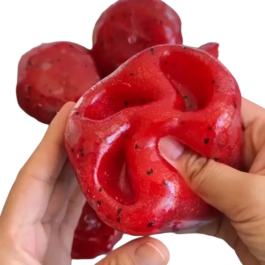 Front view of a translucent red gelatinous watermelon slushy squishy toy with black speckles and twisted knot design