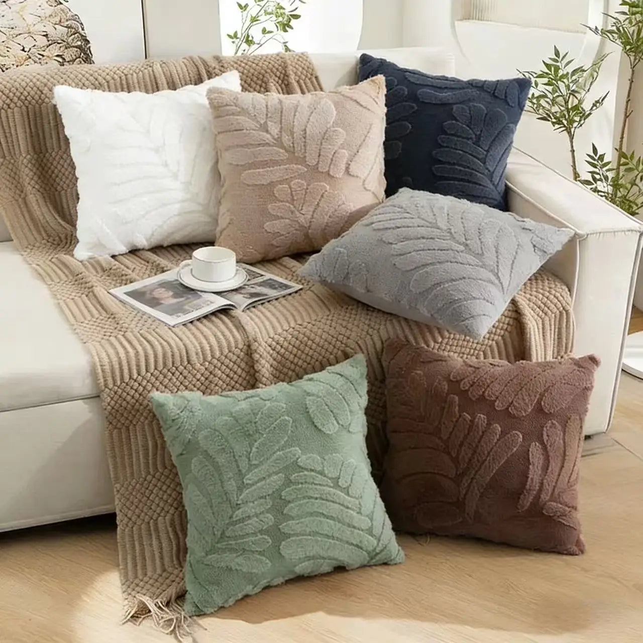 Set of six plush leaf embroidered throw pillow covers featuring cozy textured fabric in neutral tones.
