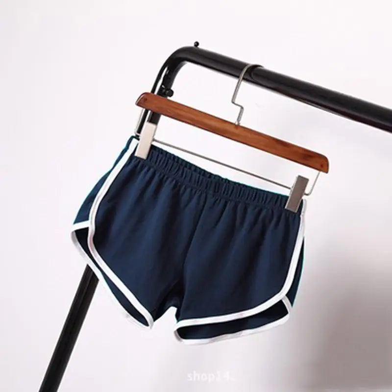Navy blue sports shorts women with white trim and elastic waist designed for casual athletic use.