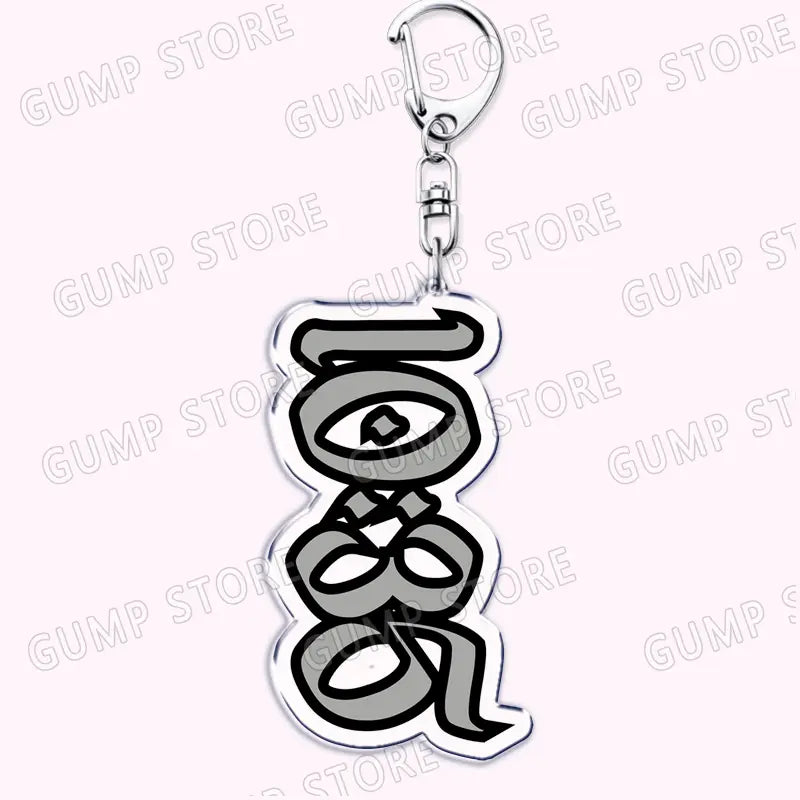 Silver acrylic Tate Mcrae keychain featuring a stylized eye-shaped design with black outlines and gray fill for music fan gift.