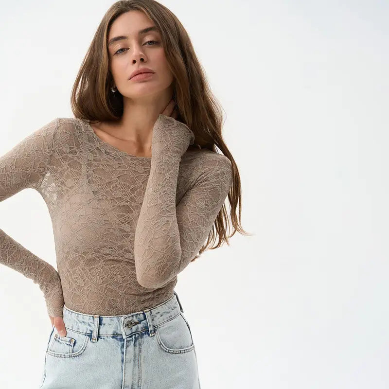 Beige long-sleeved lace bodysuit with fitted sheer design for women aesthetic clothes and aesthetic fashion.