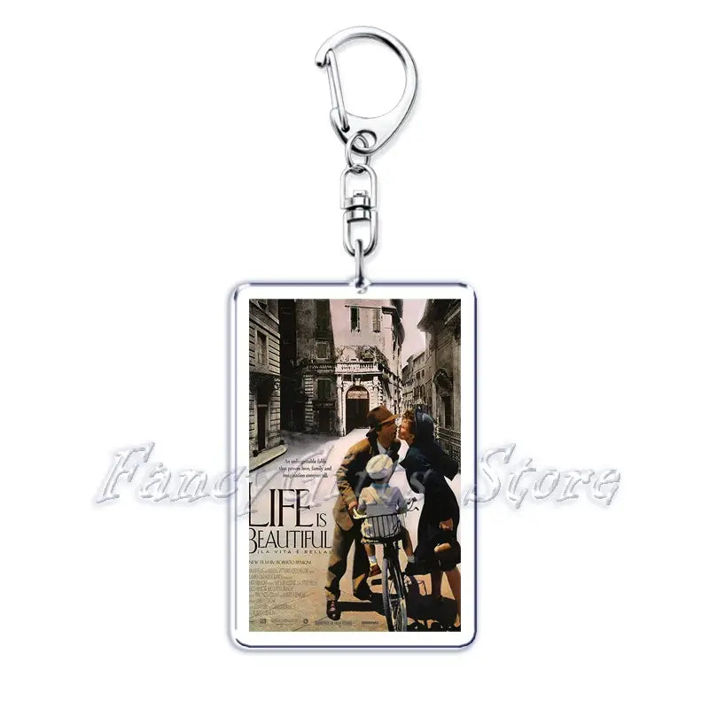 Silver rectangular acrylic keychain featuring the sepia-toned movie poster artwork of life is beautiful showing a man woman and child on a bicycle in an Italian street from the Movie Poster Acrylic Keychain Set.