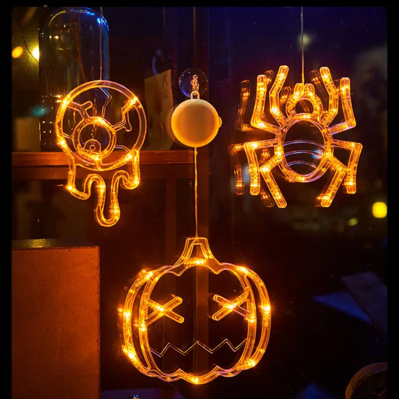 halloween window light battery operated pumpkin ghost decor featuring warm orange led lights in spider pumpkin and skull designs for festive indoor display
