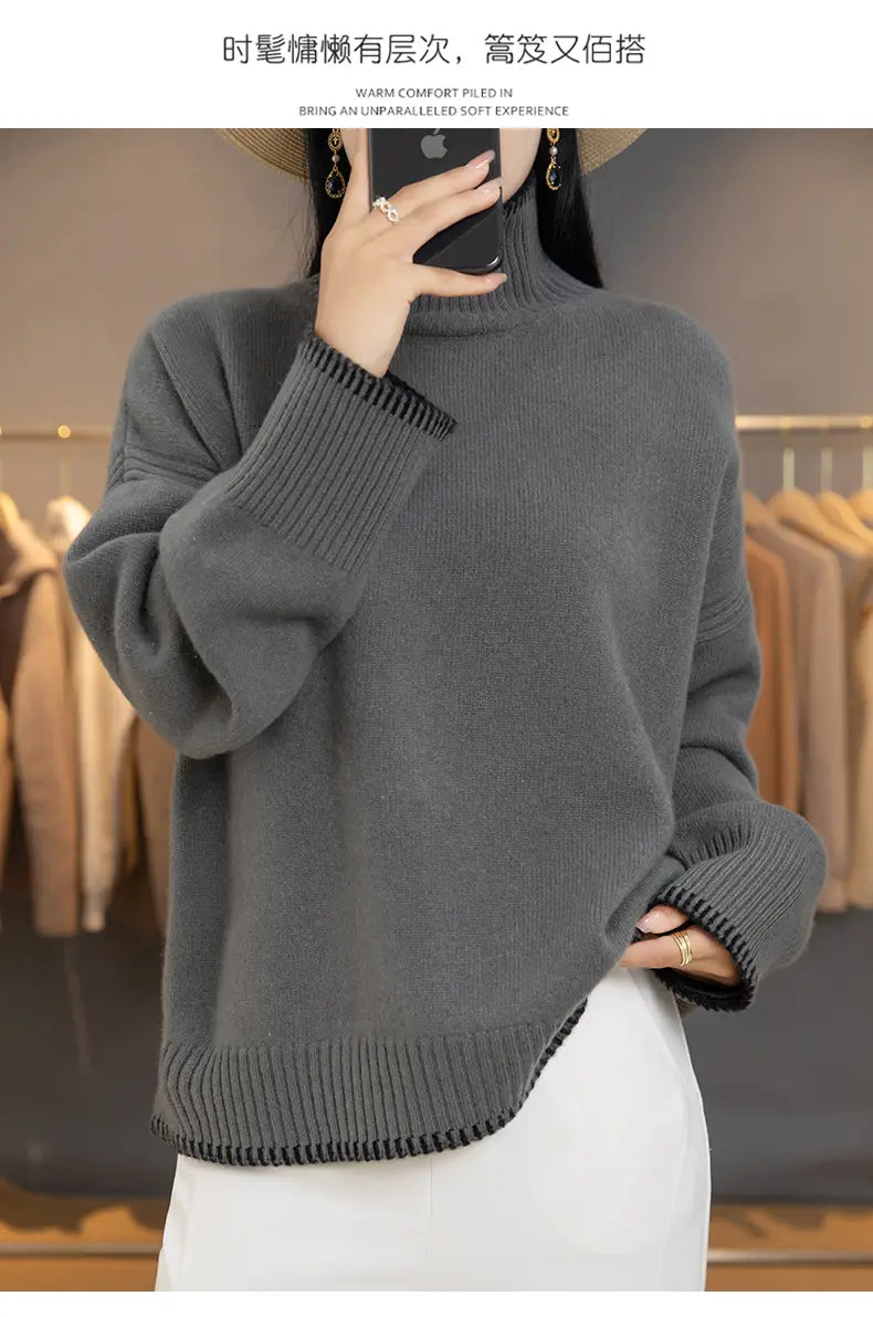 Gray oversized pure wool turtleneck sweater for women with ribbed cuffs and hem featuring a soft knit texture.