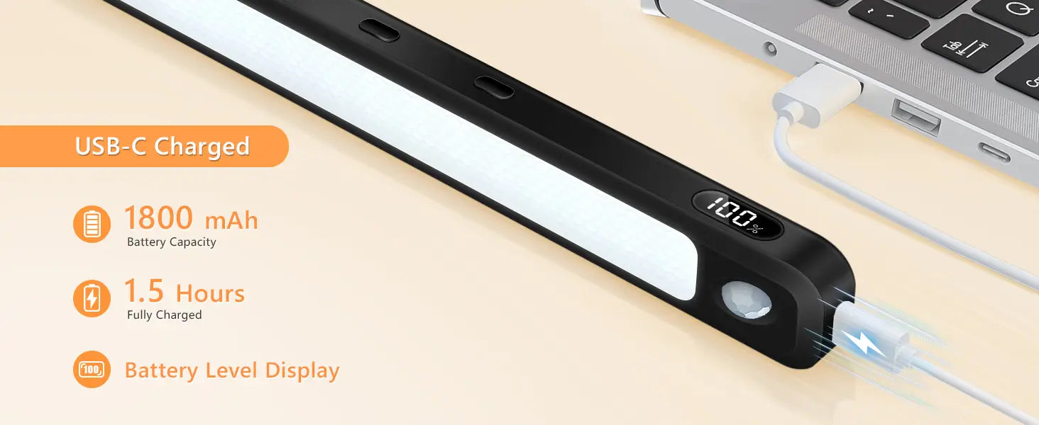 Black and white usb-c powered led motion sensor light bar with a sleek elongated iron sheet design and integrated battery display for under cabinet use.