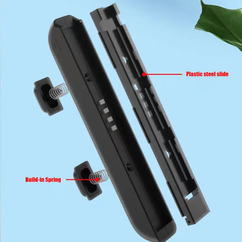 Black plastic Nintendo Switch Joy Con controller grip with integrated spring and slide mechanism shown from the back in Nintendo Switch Joy Con wrist straps and thumb grips product.