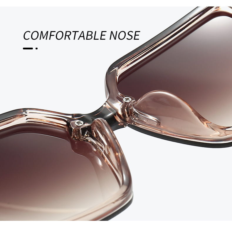 Lunettes de soleil carrées surdimensionnées en acétate ton rosé, verres dégradés marron et protection UV400, conçues comme des lunettes de créateur unisexes.