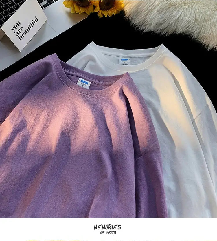 A soft lavender oversized long sleeve blank t-shirt with a simple crew neck and subtle gradient fading to white at the shoulders.