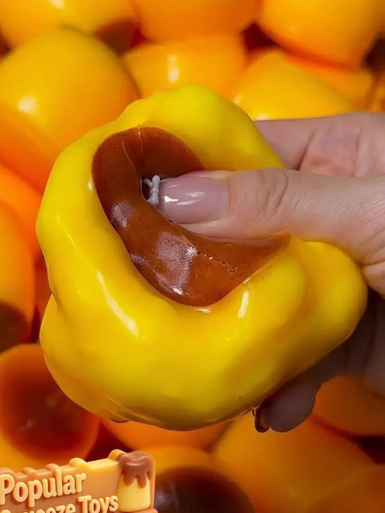 yellow and brown bell pepper shaped pudding squishy asmr stress relief toy made of soft material for sensory play and relaxation