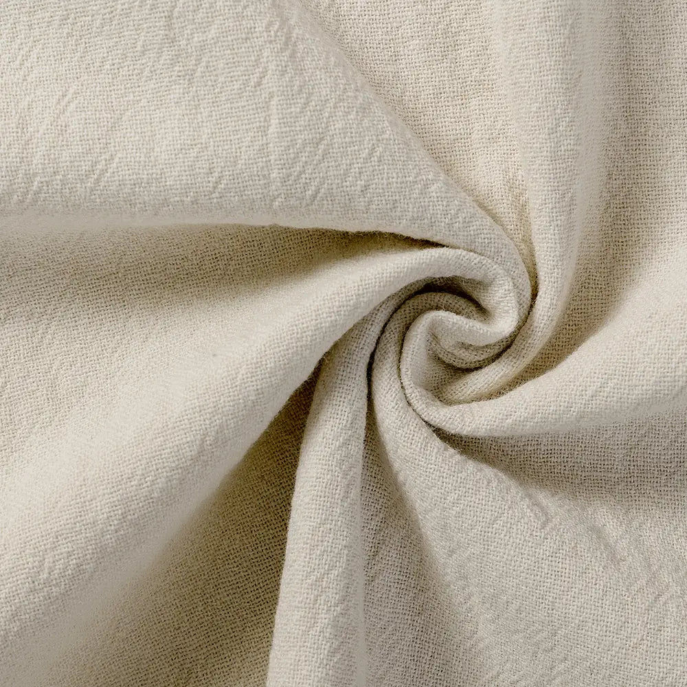 beige textured cotton fabric with a subtle woven pattern used in men cotton linen trousers breathable casual pants.