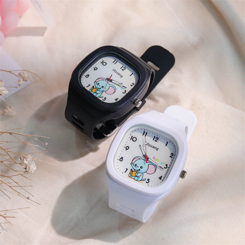 Children’s luminous digital wristwatches in black and white featuring cartoon elephant designs on the face.